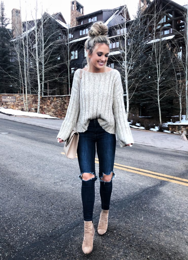 beige sweater and distressed jeans 